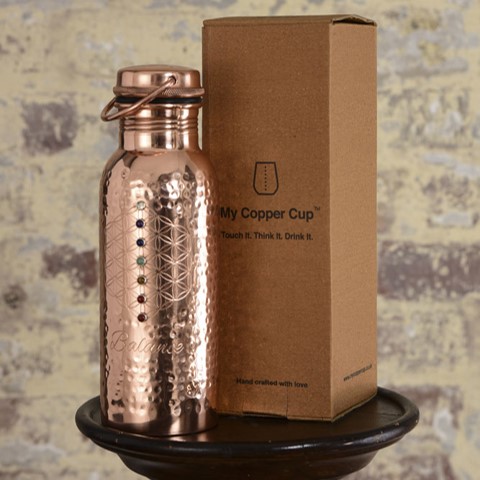 This 20oz capacity copper water bottle is beautifully and sustainably made and offers you the health benefits of copper in every mindful sip.

Copper helps reduce inflammation, promote collagen production to improve skin health, aid digestion helping with weight loss and alkalize water to name just a few.

This copper balance bottle will naturally sterilize (kill harmful bacteria found in drinking water), alkalize and re-mineralize the water you drink from it. Meaning the quality of water you drink is significantly improved with additional health benefits.

Benefits of drinking water from a copper bottle

 	Sterilizes your water, removing harmful bacteria found in drinking water
 	Alkalizes your water
 	Re-mineralizes your water
 	Aids digestion
 	Reduces inflammation
 	Produces anti-oxidants
 	Helps form collagen, improving skin health

We handcraft this water bottle using pure copper. The process of engraving, welding and hand setting each stone in place occurs before the copper is lacquered so it won’t tarnish, maintaining it’s beautiful mirror finish.